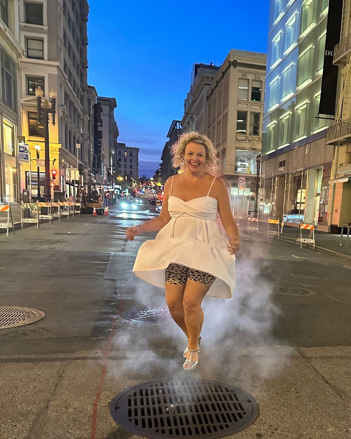 Susie playfully recreating a Marilyn Monroe moment, showing Skanties beneath a white dress